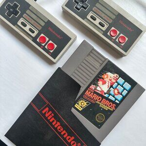 1985 Nintendo bundle featuring 2 OG NES controllers & OG Super Mario Bros. Game